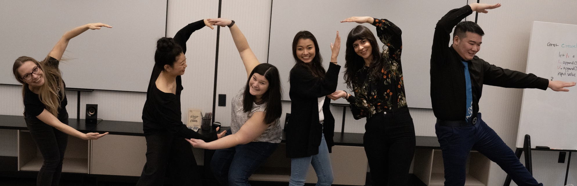 Photo of CodeSquad students spelling out "CODE"